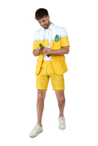A man wearing the Suitmeister Premium Beer Yellow suit and matching shorts stands smiling with a green bottle in hand against a plain white background.