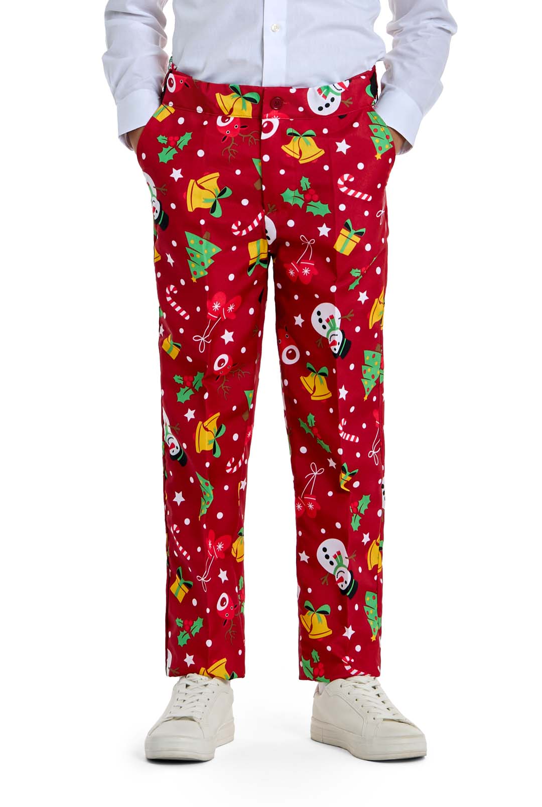 A boy dressed in Suitmeister's "Christmas Red Icons - Light Up" pants featuring festive patterns, paired with white shoes and shirt, stands with hands in his pockets.