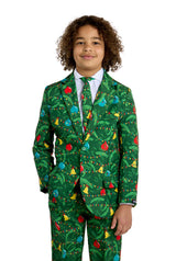 A young boy wears the Suitmeister BOYS Christmas Green Tree - Light Up suit, featuring colorful ornaments and lights, a white shirt, and festive tie, standing and smiling against a plain white background.