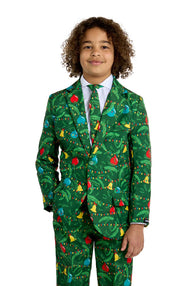 A young boy wears the Suitmeister BOYS Christmas Green Tree - Light Up suit, featuring colorful ornaments and lights, a white shirt, and festive tie, standing and smiling against a plain white background.