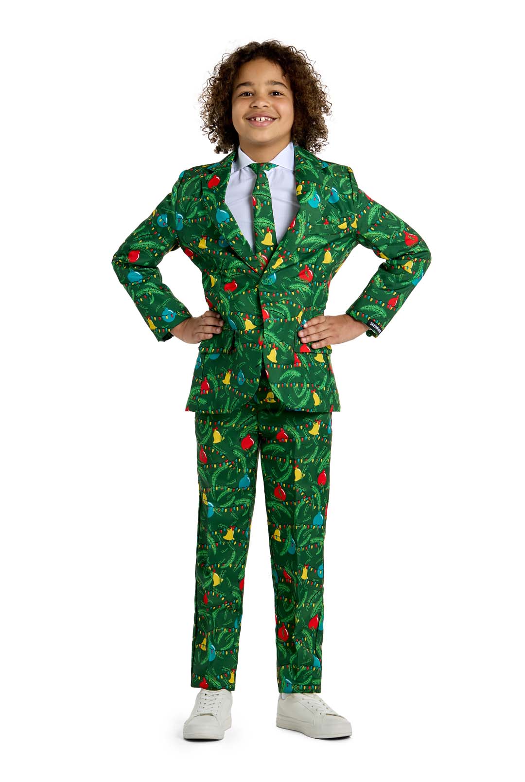 A child smiles with hands on hips, wearing the Suitmeister BOYS Christmas Green Tree - Light Up suit against a plain white background.