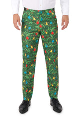 A person wearing Suitmeister's Christmas Green Tree - Light Up pants, featuring a festive holiday lights pattern, paired with a white dress shirt and black dress shoes, stands against a white background.