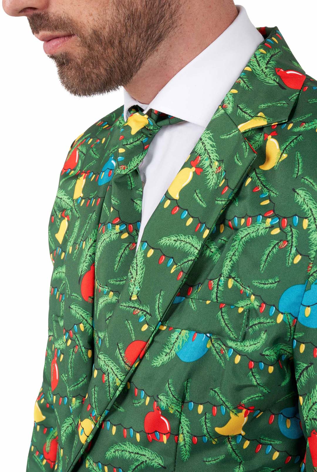 A man wears the Suitmeister Christmas Green Tree - Light Up suit, featuring Christmas tree branches, ornaments, and holiday lights. Only his lower face and upper body are visible; the look includes a matching festive tie.