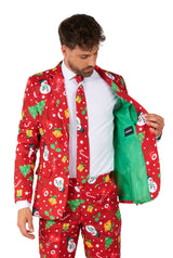 A man in a Suitmeister Christmas Red Icons - Light Up suit, featuring festive patterns and a light green lining, opens his jacket and looks down at the inside.
