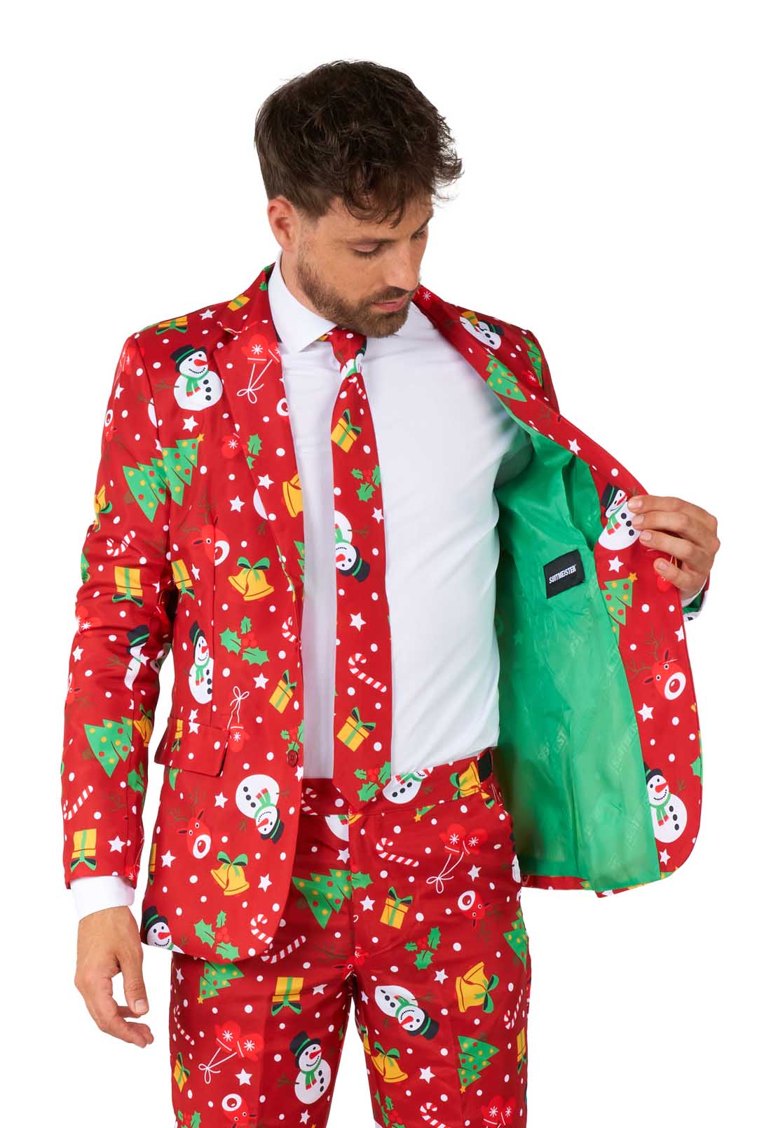 A man in a Suitmeister Christmas Red Icons - Light Up suit, featuring festive patterns and a light green lining, opens his jacket and looks down at the inside.