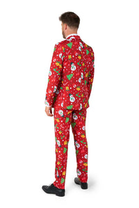 A man faces away, dressed in the Suitmeister Christmas Red Icons - Light Up suit featuring snowmen, Christmas trees, presents, and white snowflakes. He wears black shoes and stands against a plain white background.