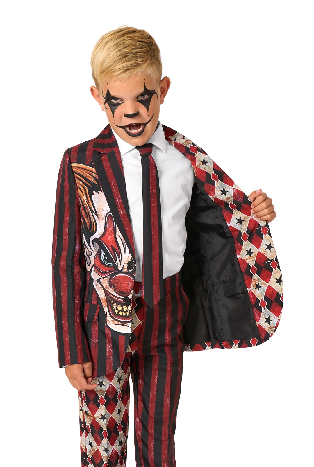 A child in a red and black clown-themed suit opening one side of the jacket to show the inner lining while wearing clown makeup.
