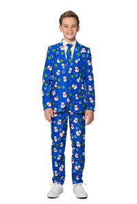 A young boy is beaming with joy in a Suitmeister's Christmas Suit Blue Snowman. The festive attire features a cheerful Christmas-themed pattern adorned with snowmen, holly, and presents. He stands against a plain white background while wearing white shoes.