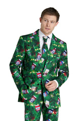 A man wears the Suitmeister "Christmas Beers Green" suit, featuring festive pine branches and colorful soda cans, with a white shirt and tie, standing against a plain white background.