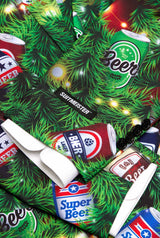 A close-up of Suitmeister's "Christmas Beers Green" festive suit jacket featuring a Christmas tree design with colorful cartoon beer cans, white shirt cuffs, black buttons, and the Suitmeister brand label.