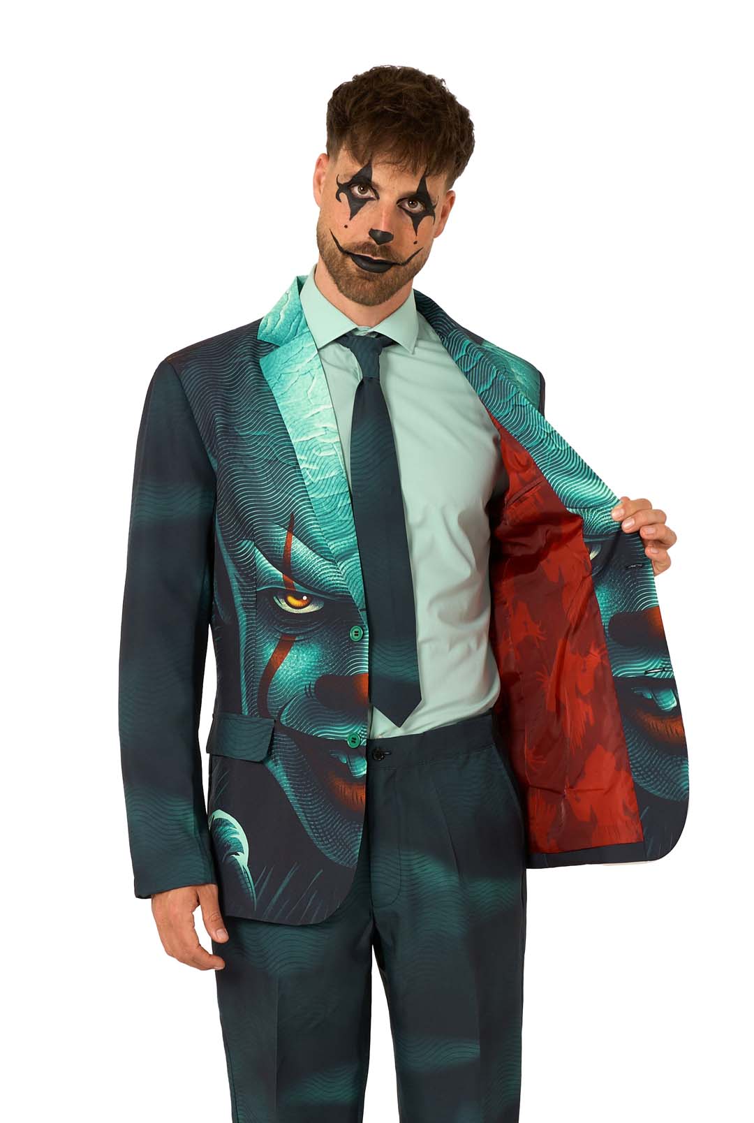 Wearing the Suitmeister IT™ Halloween suit, a man with dramatic clown face paint opens his teal and black jacket, printed with a creepy clown face and red lining, revealing a mint green shirt and tie.