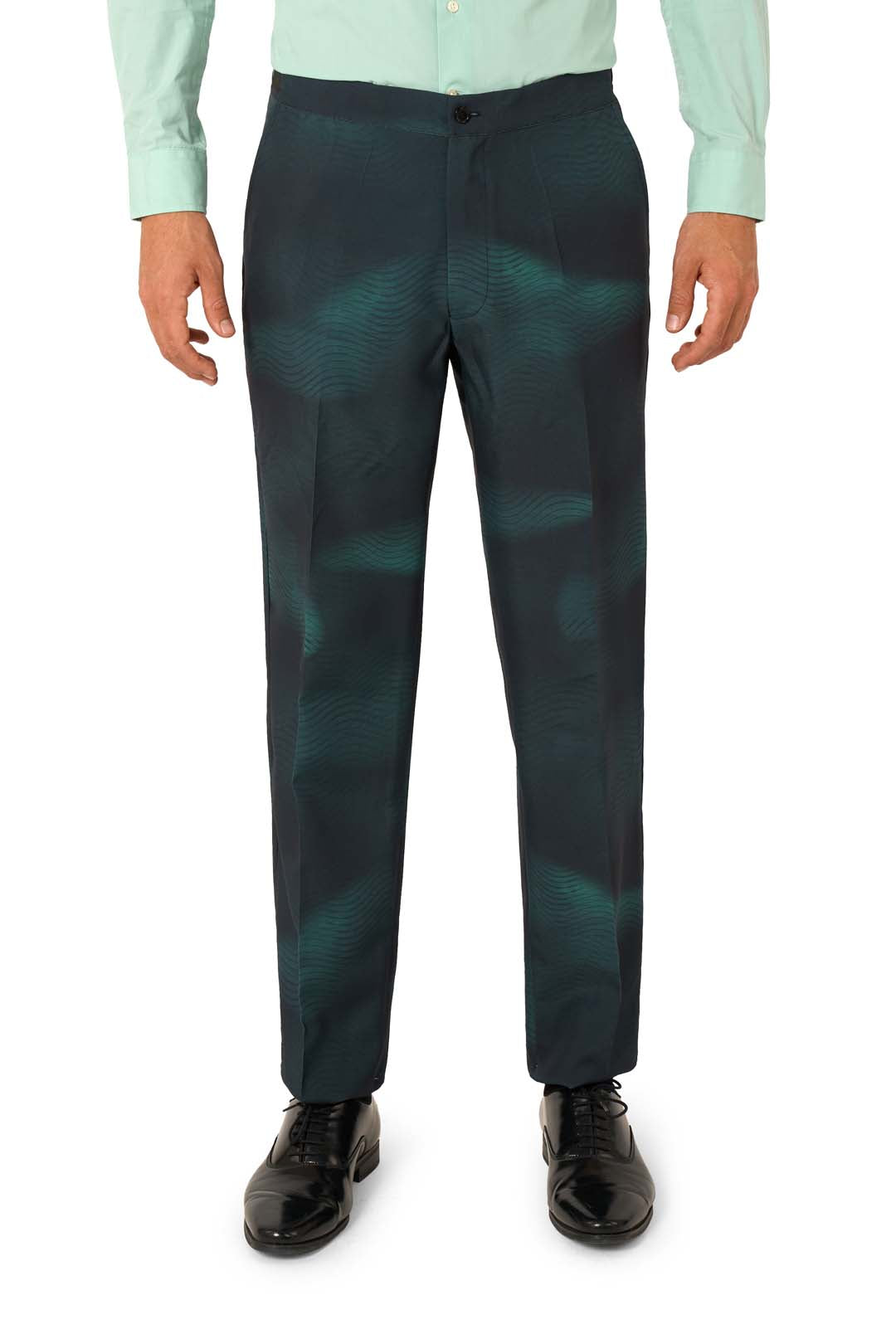 A person wearing the Suitmeister IT™ Halloween suit stands with arms relaxed at their sides against a white background. The outfit features a mint green button-up shirt, dark teal patterned dress pants, and black dress shoes.
