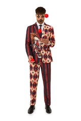 Man in creepy clown Halloween suit juggling red balls, wearing red horror-themed costume with clown print and bold patterns from Suitmeister.